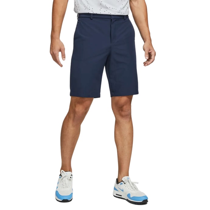 Navy blue golf shorts with a nike swoosh logo on the side.