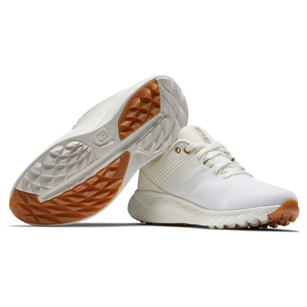 White and brown athletic shoe with textured sole, mesh upper, puma brand.
