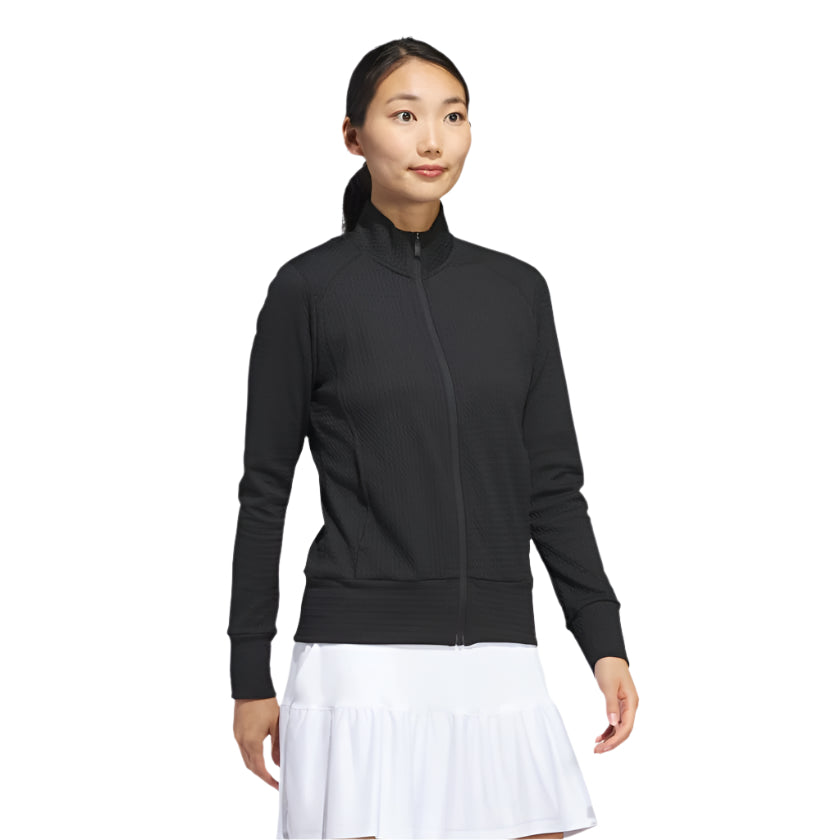 Black zip-up tennis jacket with white accents and nike logo.