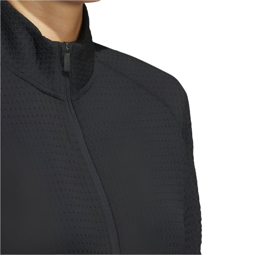 Black zip-up jacket with a high collar and textured fabric.